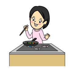 野菜炒めを作る女性